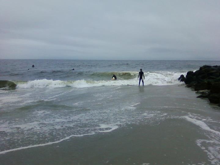 Surfers in Monmouth Beach. Photo credit: Joe Irace