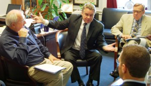 FEMA Administrator Craig Fugate, left, and Congressman Chris Smith, center, meet with their staff members in Smith's office on June 6, 2013