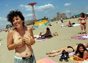 Phoenix Feeley on Coney Island NY beach where female toplessness is legal. Photo via JetsNation.