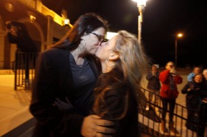 Kissing Brides, Heather Jensen and Amy Quinn, an Asbury Park Councilwoman, celebrate their marriage shortly after midnight on October 21.  facebook photo