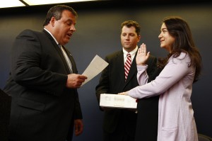 Kevin O'Dowd, center, holds the Holy Bible while Governor Christie administers the Oath Of Office to Mary O'Dowd, Kevin's wife, to be Commissioner of Health and Senior Services, June 3, 2011. Photo by Tim Larsen/Governor's Office