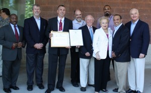 Pictured left to right: OSJL Regional L.P. Manager Bill Thompson, OSJL Director of Store Operations Paul Cox, OSJL Sales Manager Edmund Lynn, OSJL Regional Director Pat Nevue, Mayor Donald Burden, Freeholder Director Lillian G. Burry, OSJL Assistant Manager Hakeem Reynolds, Freeholder Thomas A. Arnone and Freeholder John P. Curley.  