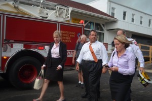 Bridget Ann Kelly, texting, with Governor Chris Christie and Michelle Brown at Seaside Park fire, September 12, 2013, photo by Phil Stilton