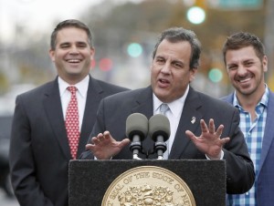 Belmar Mayor Matt Doherty laughs with approval during Governor Chris Christie's famous "Sit Down and Shut" speech during the Two Year Anniversary Community Event in Belmar, N.J. on Wednesday, Oct. 29, 2014. (Governor's Office/Tim Larsen)