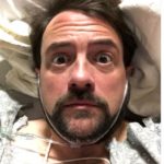 Kevin Smith suffers massive heart attack, tweets ‘for now, I’m still above ground’